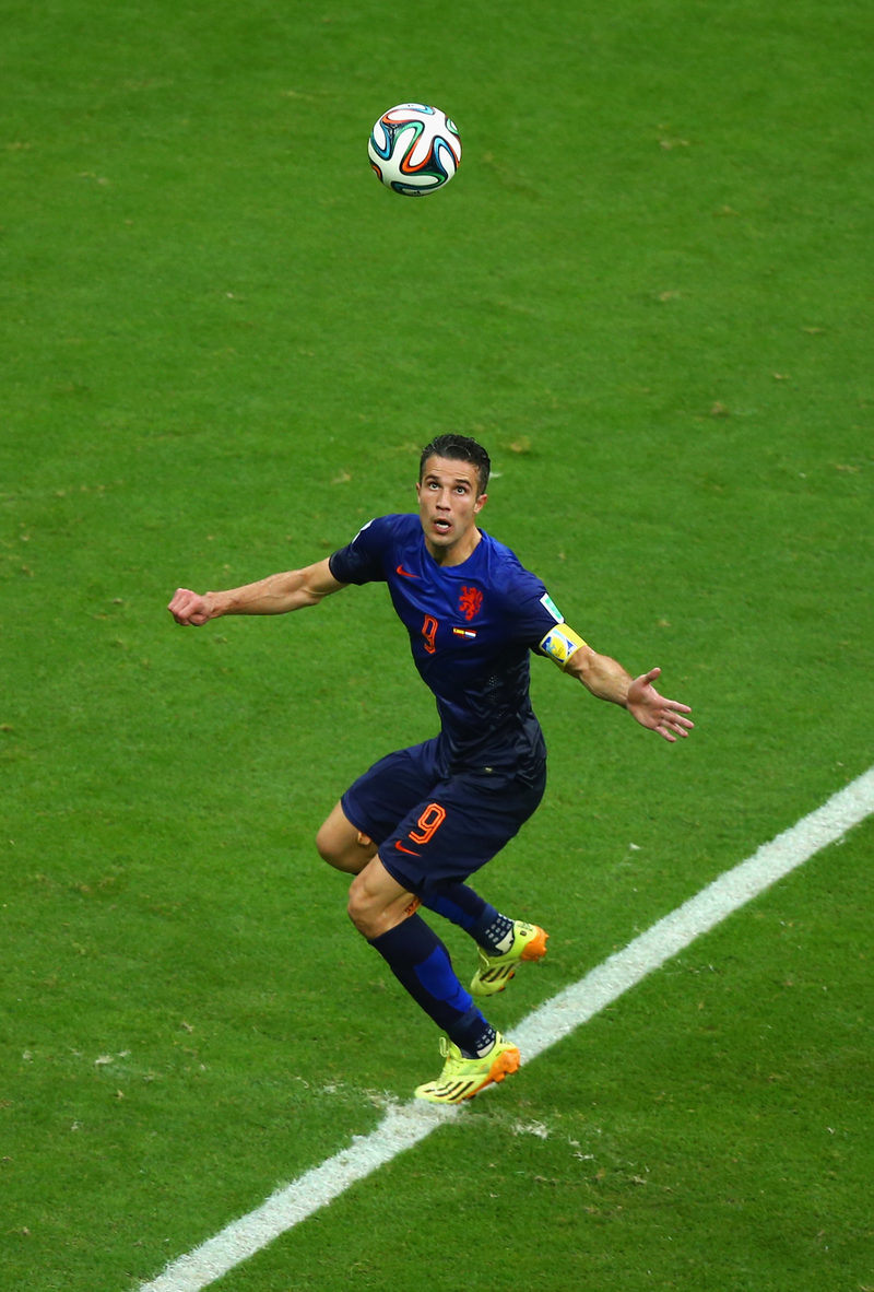 Illustration for article titled The Best Photos Of Robin Van Persie's Amazing Flying Header Goal